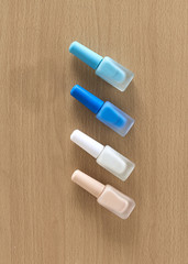 Pastel Blue nails polish on table