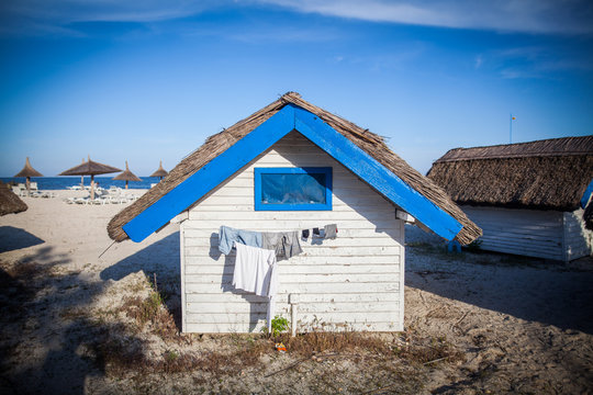 Blue and white painted hut in a sea resort.