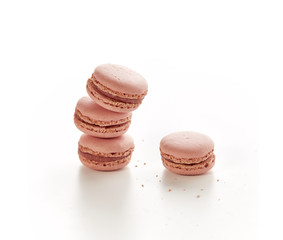 four strawberry flavored macaroons