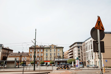 Obraz premium Street of the city of Krakow. The old Town. Public transport on the streets. Trams and buses. Polesha. City center.