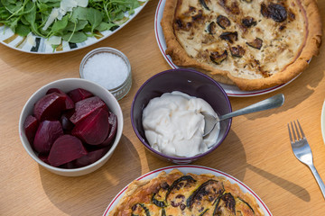 Looking down on an outdoor table set for a summer lunch