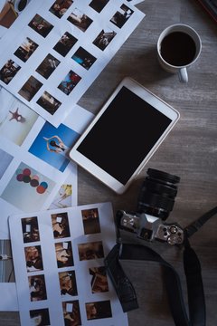 Digital tablet, camera and documents on a table