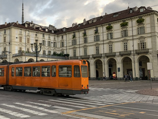 Fototapeta na wymiar long shot of a street in a big city where an old tram passes