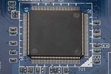 Electronic board. The board features elements: chips, diodes, capacitors, chokes. Shallow depth of...