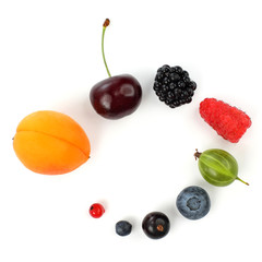 Naklejka na ściany i meble different juicy berries laid out in a circle on a white background