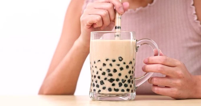 Woman drink of iced bubble mile tea