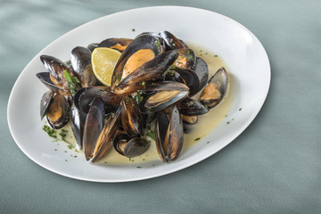 Mussels cooked with lemon and white wine (w/clipping path) Seafood plate specialty of both France and Belgium