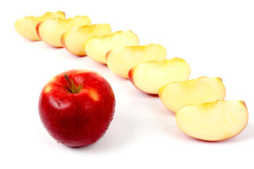 red apple on a background of cut pieces of apple