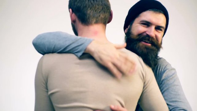 Two men are welcomed at a meeting. Unexpected meeting of two men. Concept of squeezing