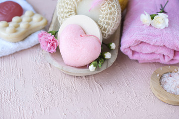SPA and bathroom accessories. Photo in pink colors. Live flowers and soap. RELAX. Copy space. Flat lay,