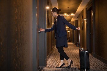 Businesswoman entering in hotel room