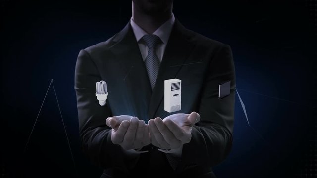 Businessman opens two palms, Artificial intelligence brain connecting monitor, microwave, light bulb, washer, air conditioner, audio, coffee pot,  smart Home Appliances, Internet of things concept.