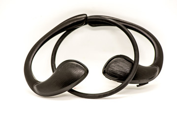 Black wireless earphones on white background