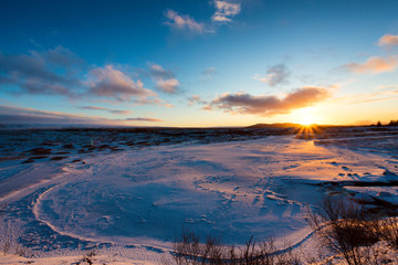 Sunset on icelandeic tundra with snow and ice - obrazy, fototapety, plakaty