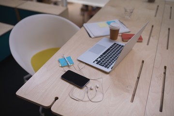 Laptop and mobile phone on a desk