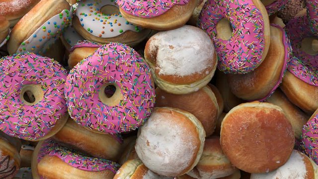 Falling Different donuts on a pink background