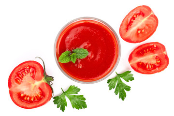 Tomato juice in glass and tomatoes with parsley leaves isolated on white background. Top view. Flat lay