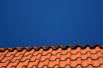 Orange roof with blue sky