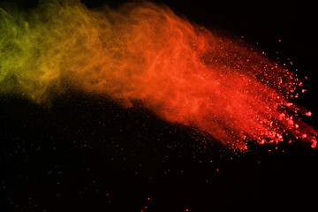 abstract colorful powder splatted isolated on black background, Freeze motion of color powder....