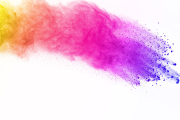 abstract colorful powder splatted isolated on white background, Freeze motion of color powder....