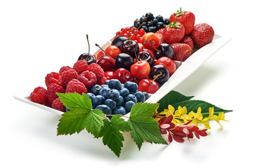 A mixed arrangement. Assorted berries including strawberry, cherry, blueberries, raspberries, black currant and red currant, isolated on white background.