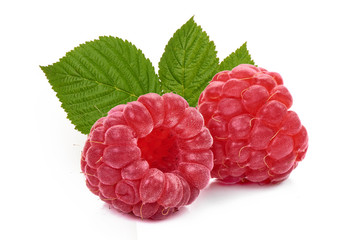 Fresh and ripe raspberry with leaves, isolated on white background. Close-up.