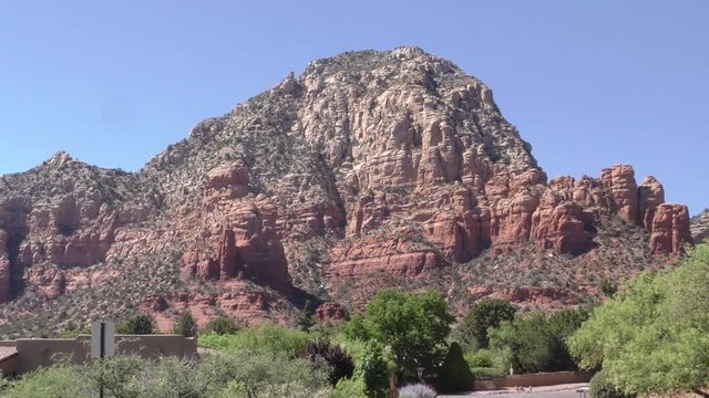 Arizona, Sedona, A Zoom Out From Capitol Butte To See A House In The Foreground