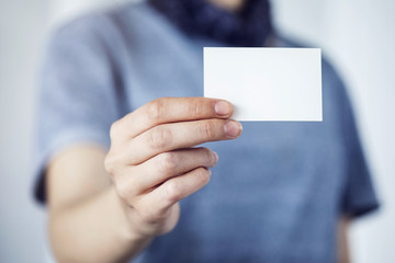 Business woman showing business card