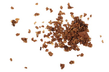 Crunchy granola, muesli pile with chocolate isolated on white background, top view
