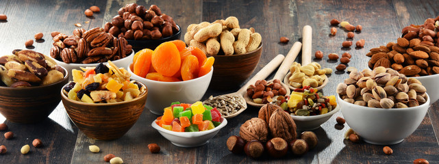 Composition with dried fruits and assorted nuts - obrazy, fototapety, plakaty