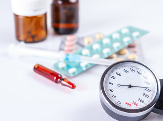 Medical manometer, syringe, ampoules and tablets.