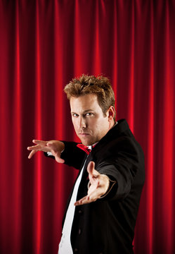 Magician: Man Gesturing to Audience
