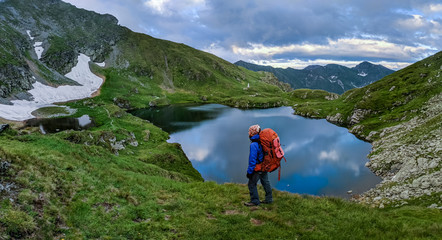 Hiking in mountains with picturesque views and landscapes near lake
