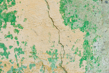 Wall fragment with scratches and cracks