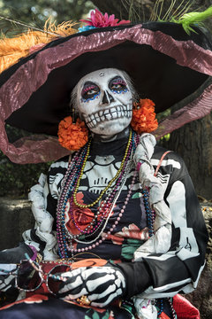 Fancy and elegant sugar skull woman called Catrina. Elaborate make-up for the Day of the death celebration in Mexico