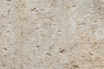 Wall fragment with scratches and cracks