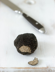 Mushroom black truffle on a wooden table. Found in Moldova in July 2018.