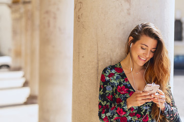 Fototapeta premium Beautiful young woman listening music