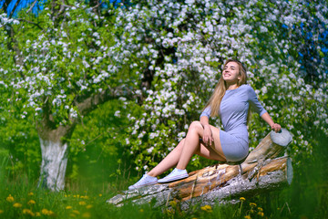 Portrait of the beautiful girl model in the spring in the park