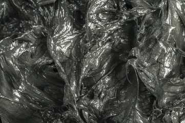 Black lubricating grease Close-up shot of special lubrication for automotive uses