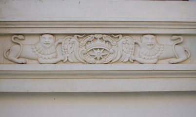 element stucco cats on the wall