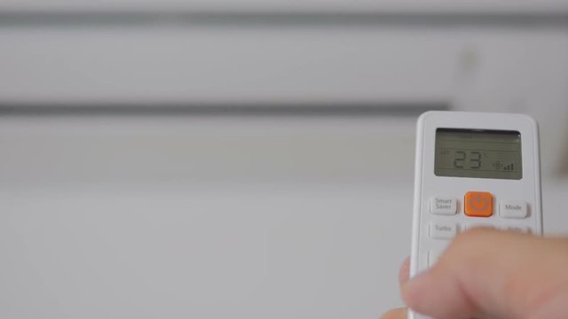 The hand with the remote control includes a domestic conditioner