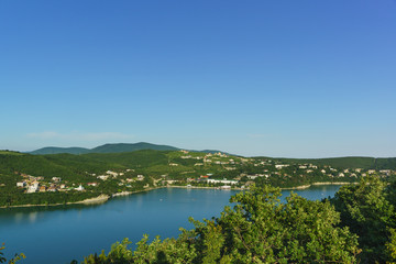 Fototapeta na wymiar Top view of beautiful lake Abrau and a village of Abrau-Durso Novorossiysk city district