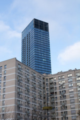 skyscraper behind residential buildings