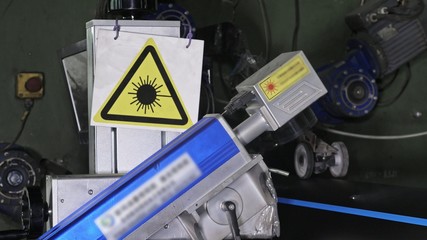 Laser Marking Machine Engraving. Manufacture of plastic water pipes of the factory. Process of...