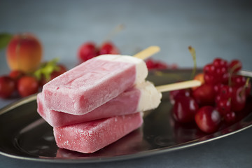 Fruit sorbet of summer fruits and berries on metal plate.