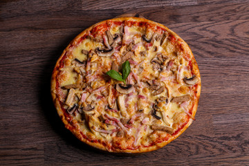 Pizza with ham and mushrooms