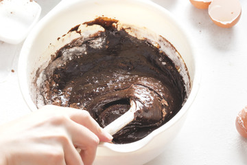 Mixing chocolate brownies batter  - obrazy, fototapety, plakaty