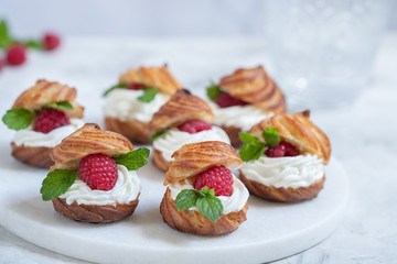 Raspberries Profiteroles with White Chocolate cream