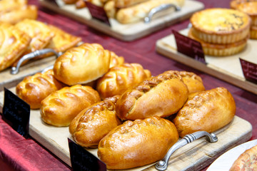 Traditional Russian pies are on the counter in the store.